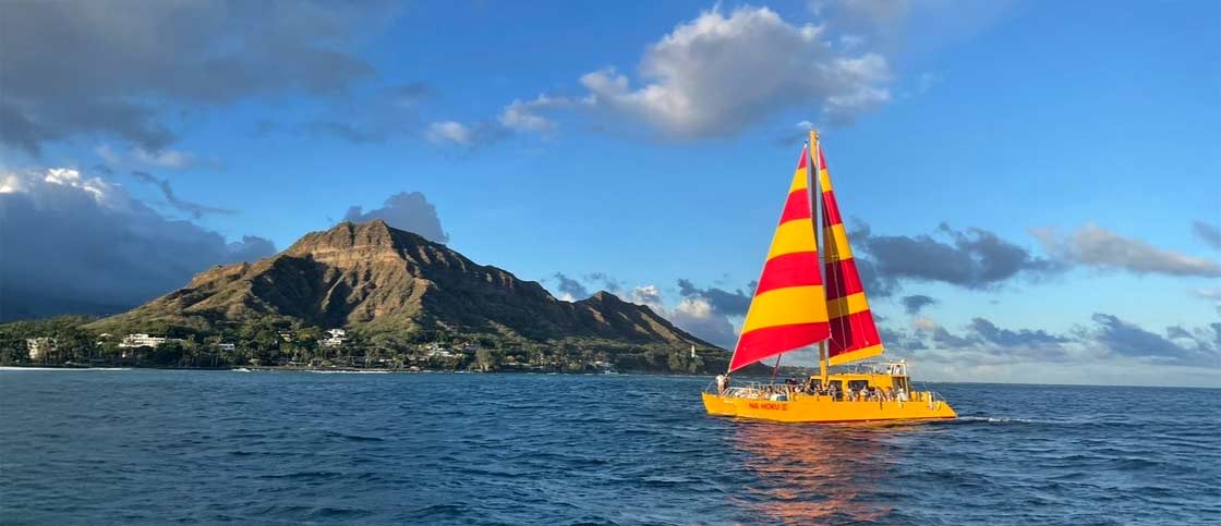 Na Hoku II catamaran on the water during Friday night fireworks